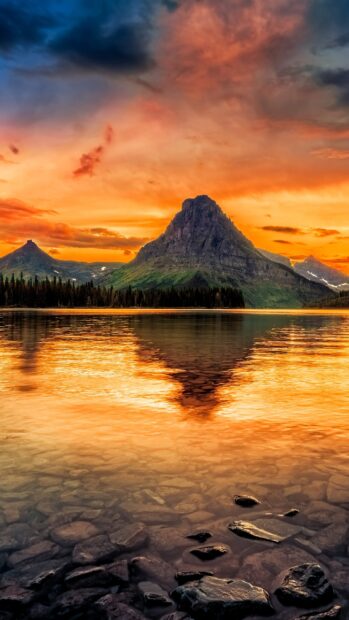 The sunset lights up Glacier National Park with reflection on the lake and mountains, 2K Mobile Wallpaper