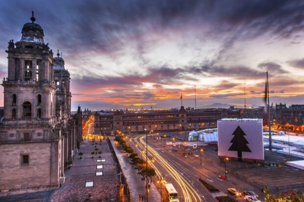 The sunset view over Mexico City central plaza shows historic buildings and busy streets, HD Desktop Wallpaper