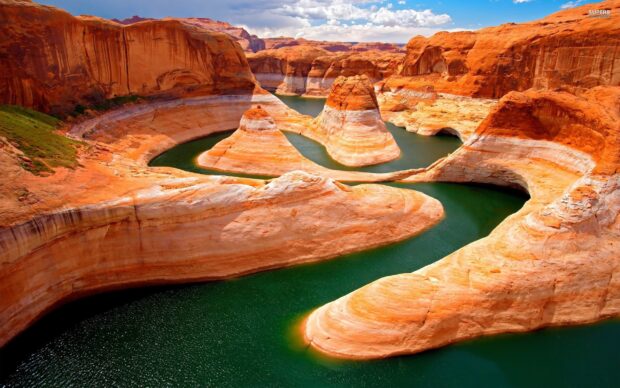 The Colorado River winding through red rock formations in a desert landscape
