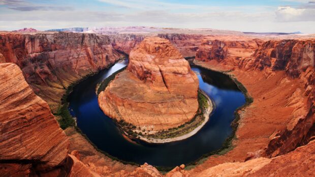The Colorado River winding through the red rock canyon landscape at Horseshoe Bend