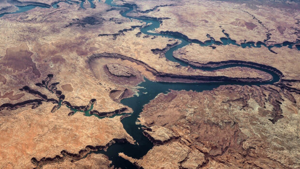 Aerial view of the Colorado River winding through rocky desert terrain