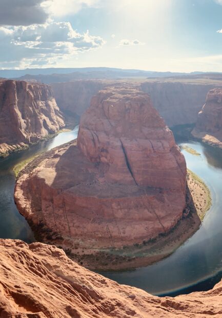 The Colorado River flowing through the massive canyon rock formation