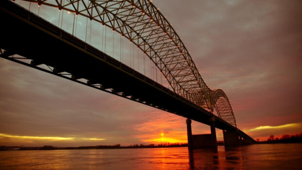 The Mississippi River shows a bridge over calm waters during a colorful sunset, HD Desktop Wallpaper
