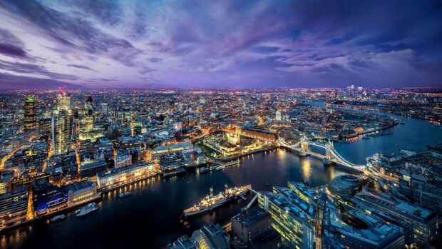 The River Thames wallpapers show a vibrant illuminated city skyline along the river at dusk, 4K Desktop Wallpaper