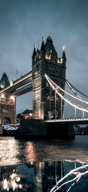 The River Thames features Tower Bridge illuminated with reflections on the water at night, HD Phone Wallpaper