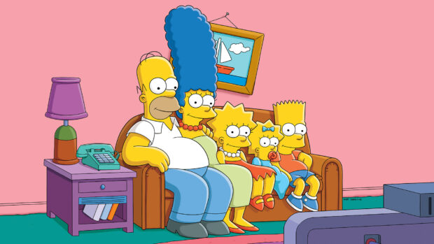 The Simpsons family sitting on the couch in the living room