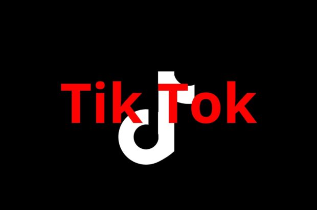 Red TikTok logo on black background for popular social media platform