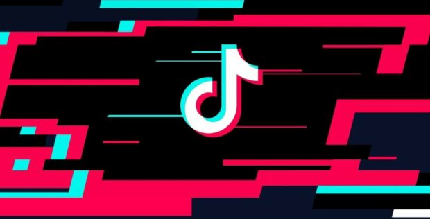 The TikTok logo glitch effect with vibrant red and blue colors on a black background