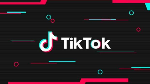 TikTok logo and name with digital glitch effect on a black background featuring vibrant colors