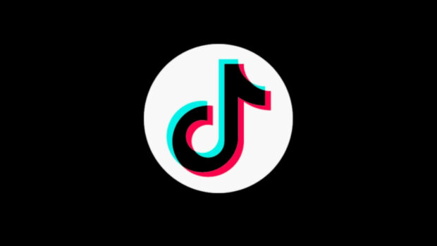 TikTok logo with glitch effect on a black background featuring TikTok design