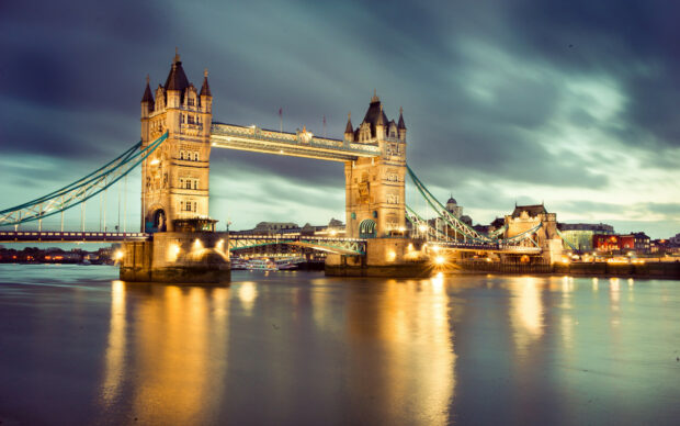 Tower Bridge is beautifully illuminated over the River Thames at night in the United Kingdom, HD Desktop Wallpaper
