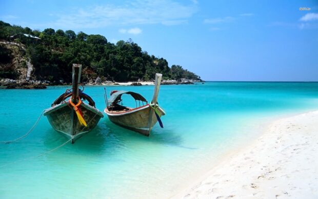 Two traditional boats float near the beach in turquoise water on Zanzibar, HD Desktop Wallpaper