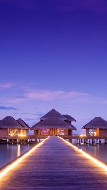 The bungalow shows a peaceful overwater structure glowing softly in the evening light, HD Phone Wallpaper