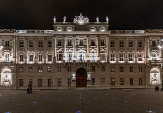 The illuminated historic building in Trieste stands majesty at night showing elegant details, HD Desktop Wallpaper
