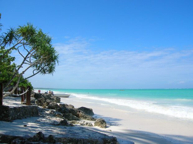 A tropical Zanzibar coast scene with clear turquoise sea and sandy beach, HD Desktop Wallpaper
