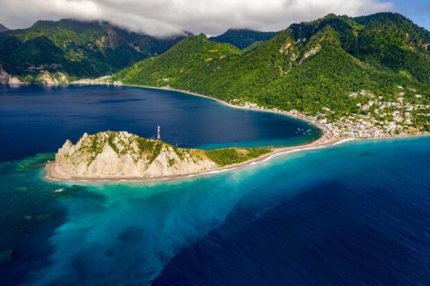 Aerial view of Dominica Island with clear blue waters and lush green mountains, HD Desktop Wallpaper
