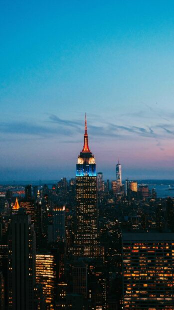 Empire State Building illuminated at dusk in United States skyline