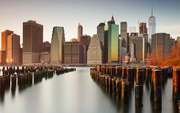 Sunset view of United States city skyline with wooden piers in the foreground