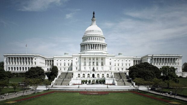 The United States Capitol building stands prominently in Washington with clear skies above