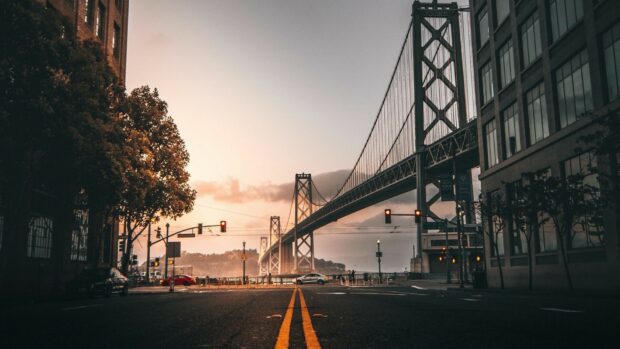 The city street with bridge and cars at sunset in United States