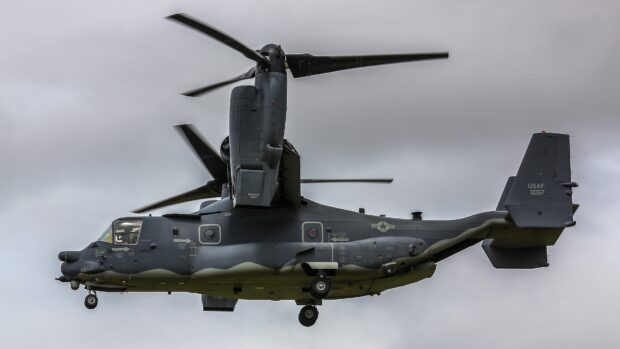 Military aircraft V 22 Osprey in flight showing detailed design and rotor blades