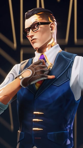 Agent from Valorant wearing glasses and a blue vest with gold accents in a close up portrait