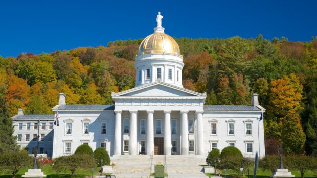 The Vermont State Capitol building is surrounded by fall foliage in this Vermont wallpapers, 2K Desktop Wallpaper