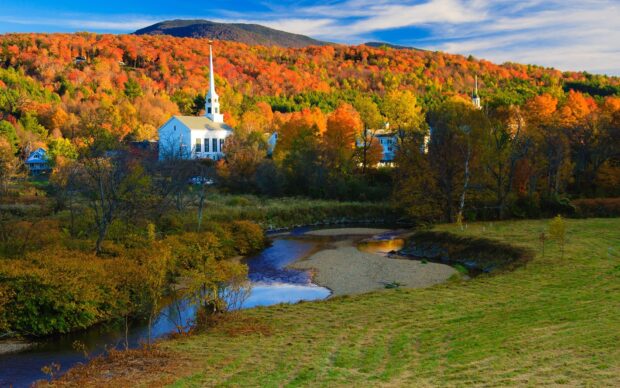 A river flows past a village with churches surrounded by colorful autumn trees in Vermont, HD Desktop Wallpaper