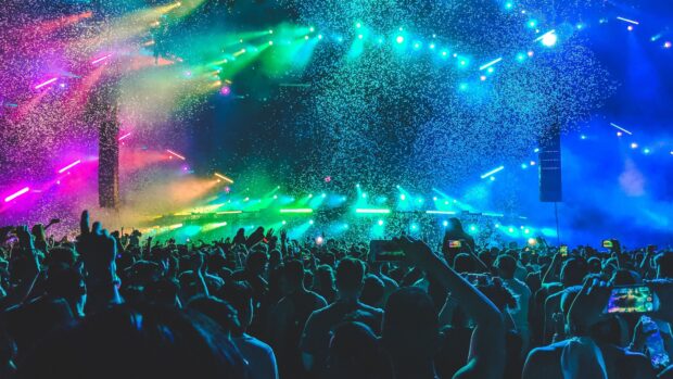 A vibrant nightclub lighting effects show with a cheering crowd enjoying the music, 4K Desktop Wallpaper