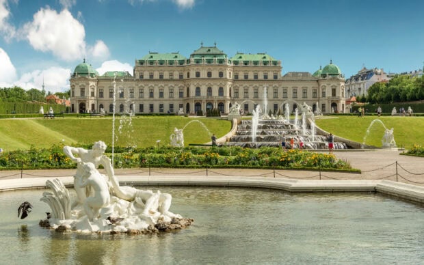 Beautiful Vienna palace and garden sculpture in Austria with clear sky