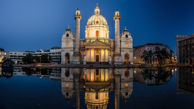 Historic Vienna Austria architecture reflected in calm water at dusk