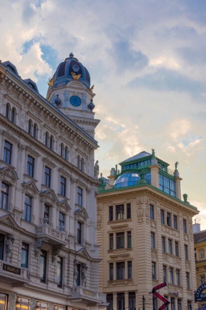Historic Vienna Austria architecture with clock tower under cloudy sky