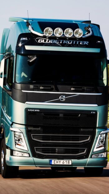 Volvo truck driving on highway showcasing Globetrotter cabin design