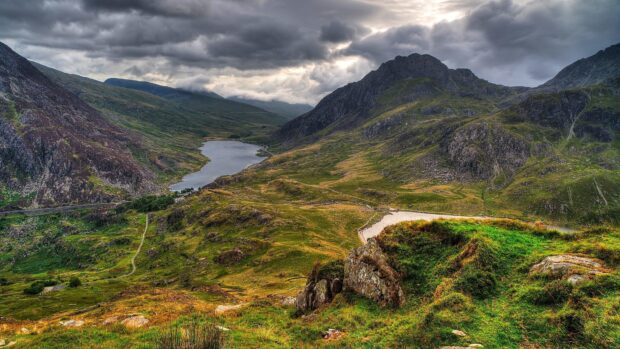 A scenic view of Wales with mountains and a lake under a cloudy sky, 4K Desktop Wallpaper