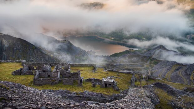 The Wales wallpaper shows ancient mountain ruins with mist over a scenic lake in the background, 4K Desktop Wallpaper