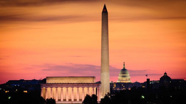 Washington Monument is seen with the Lincoln Memorial and Capitol building during sunset
