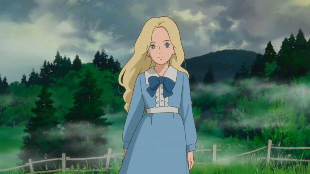 A young girl from When Marnie Was There stands in a misty forest clearing with mountains behind her