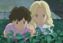 Two characters from When Marnie Was There anime observing plants closely in a serene garden setting