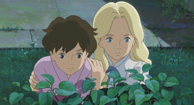 Two characters from When Marnie Was There anime observing plants closely in a serene garden setting