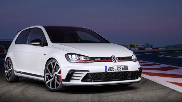 A white Golf Gti car is parked on a race track during dusk with headlights on, 2K Desktop Wallpaper