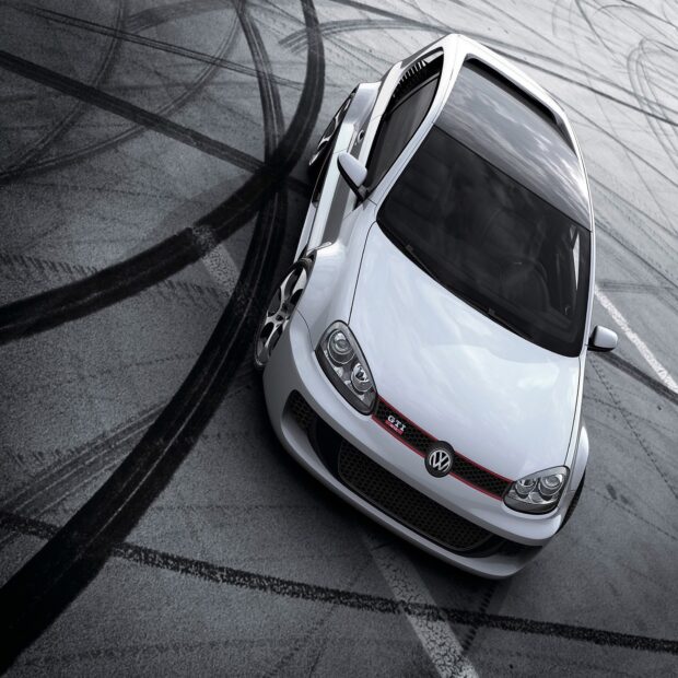 A white Volkswagen Golf Gti is parked on a track with tire marks around it, HD Desktop Wallpaper