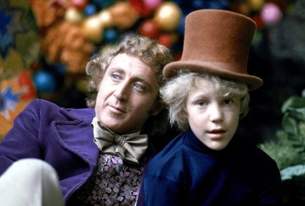 Willy Wonka and a boy with a brown top hat from the original movie Willy Wonka