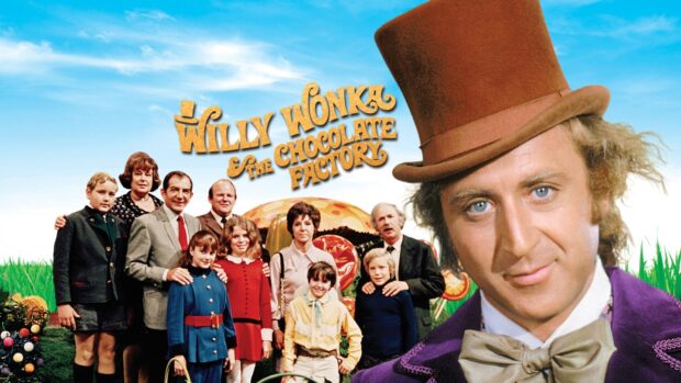 Willy Wonka character and children from the movie posing in a colorful candy garden