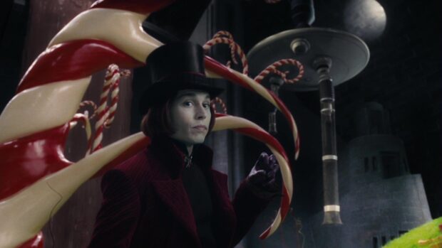 Willy Wonka character standing in a candy factory surrounded by large twisted candy canes