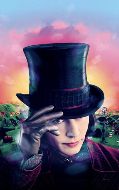 Willy Wonka character tipping his black hat in a colorful fantasy landscape