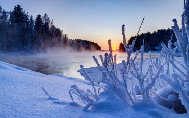 The scenery wallpapers show a frozen river with snow and frost at sunrise, HD Desktop Wallpaper