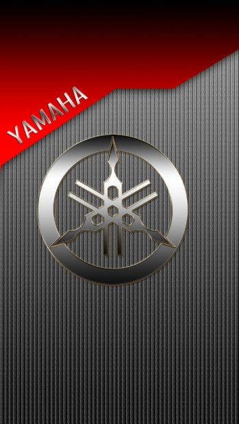 Silver Yamaha logo on textured carbon fiber background with red corner and Yamaha text