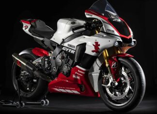 High quality Yamaha motorcycle with red and white design standing on a black background