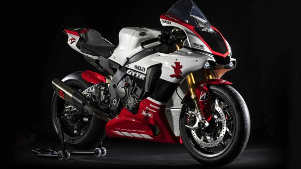 High quality Yamaha motorcycle with red and white design standing on a black background
