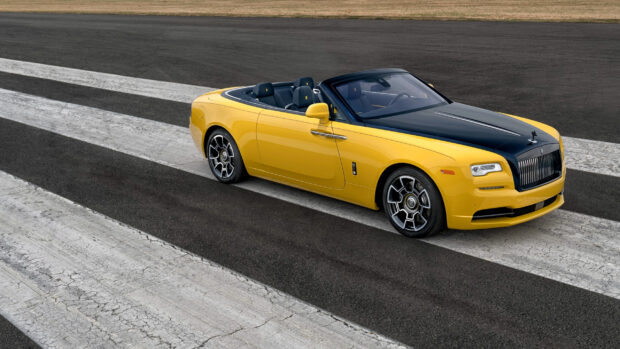 A yellow Rolls Royce Dawn is parked on a runway with clear markings, 2K Desktop Wallpaper
